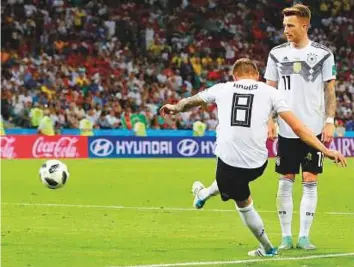  ?? AP ?? Germany’s Toni Kroos (left) scores his side’s second goal during the Group F match against Sweden at Fisht Stadium in Sochi on Saturday.