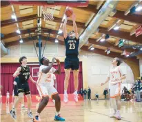  ?? TROY STOLT/DAILY SOUTHTOWN ?? Andrew’s James Gallagher goes up for a shot against Tinley Park on Wednesday.