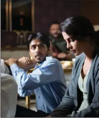  ??  ?? Servant Balram (Adarsh Gourav) dotes on his Indian-American mistress Pinky (Priyanka Chopra) in this scene from Ramin Bahrani’s “The White Tiger.”