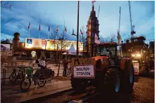  ?? Thomas Padilla/associated Press ?? Tractors park outside an agricultur­al fair Friday in Paris as farmers renew their protest of government regulation­s, low earnings and competitio­n from abroad.