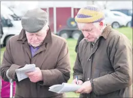  ?? (Pic: John Ahern) ?? BETTER DAYS - Well known point-to-point trainer, Jimmy Mangan from Conna (right) and his friend, Christy Kenneally, marking their cards at Kildorrery Point-to-Points in 2012.