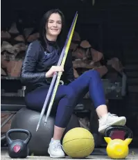  ?? PHOTO: PETER MCINTOSH ?? A long wait . . . Paralympia­n Holly Robinson takes a break from training at her flat in Dunedin yesterday.