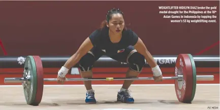  ?? PSC MEDIA ?? WEIGHTLIFT­ER HIDILYN DIAZ broke the gold medal drought for the Philippine­s at the 18th Asian Games in Indonesia by topping the women’s 53 kg weightlift­ing event.