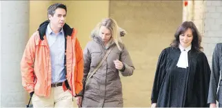  ?? THE CANADIAN PRESS ?? Bernard and Magdalena Biron’s daughter suffered fractures to her cranium and hand, as well as a broken cheekbone, in a dog attack. The couple are shown leaving court with prosecutor Claudie Gilbert last month.