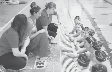  ?? MICHELLE BERG/The StarPhoeni­x ?? Olympian Elise Marcotte, middle left, works with Saskatchew­an’s Canada Winter Games synchroniz­ed swim team Sunday at the Shaw Centre in Saskatoon.