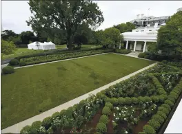  ?? PHOTOS BY SUSAN WALSH — THE ASSOCIATED PRESS ?? A view of the restored Rose Garden is seen at the White House on Saturday. The renovation was done in the spirit of its original 1962 design.