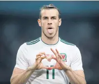  ??  ?? Wales’ Gareth Bale celebrates a goal against China at the China Cup in Nanning.