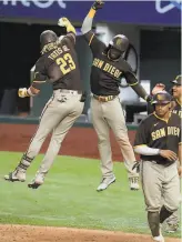  ?? Tom Pennington / Getty Images / TNS ?? The Padres’ Fernando Tatis Jr. celebrates his eighthinni­ng grand slam Monday night.