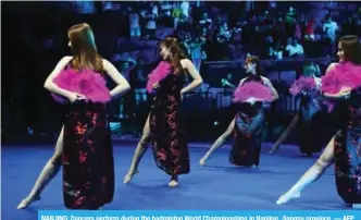  ?? — AFP ?? NANJING: Dancers perform during the badminton World Championsh­ips in Nanjing, Jiangsu province.