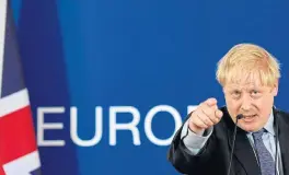  ?? /Reuters (See Page 6) ?? Hard-fought deal: Britain’s Prime Minister Boris Johnson gestures during a news conference at the EU leaders’ summit dominated by Brexit in Brussels on Thursday. British negotiator­s reached agreement with EU officials that could pave the way for Britain to finally break 46 years of ties with the EU.