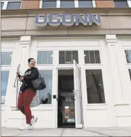  ?? Matthew Brown / Hearst Connecticu­t Media ?? Julianna Russo of Wilton carries some of her belongings as she vacates the student housing in UConn Stamford’s Residentia­l Life building on March 25.