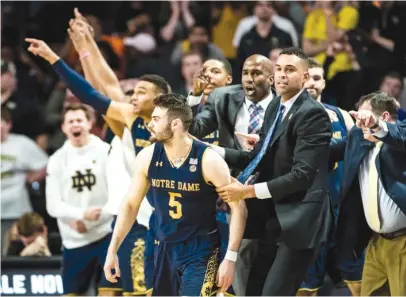  ?? | ALLISON LEE ISLEY/ AP ?? Notre Dame guard Matt Farrell reacts after hitting a three- pointer in the final seconds to beat Wake Forest.