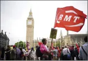  ?? (AP/PA/Yui Mok) ?? People from different unions and members of the public hold up placards as they take part in a demonstrat­ion Saturday in London to demand action on the cost of living, a new deal for working people and a pay raise for all workers.