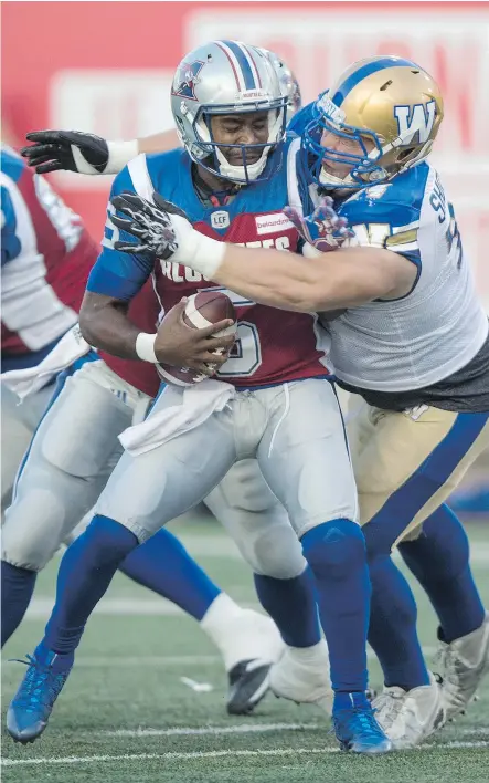  ?? — THE CANADIAN PRESS ?? Defensive tackle Keith Shologan and the Blue Bombers defence harassed the Montreal Alouettes into six turnovers on Friday night, the third straight game they have achieved that feat.