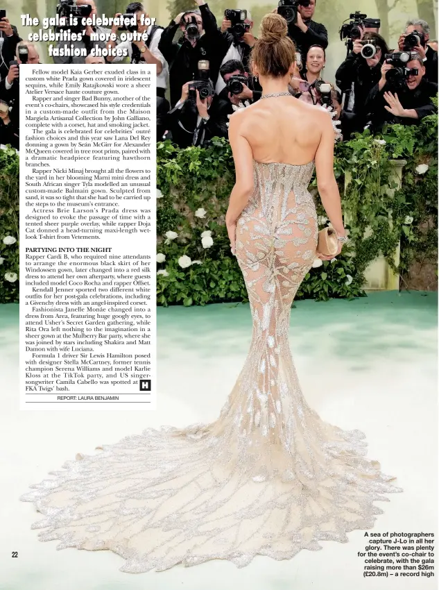  ?? ?? A sea of photograph­ers capture J-Lo in all her glory. There was plenty for the event’s co-chair to celebrate, with the gala raising more than $26m (£20.8m) – a record high