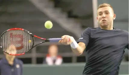  ?? — AFP ?? Daniel Evans of Team Great Britain hits a forehand against Canada’s Denis Shapovalov during the Davis Cup first round against Team Canada at TD Place in Ottawa, Ontario on Saturday. Team GB now leads 1-0 in the series.