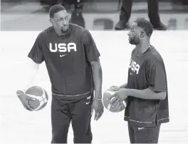  ?? ETHAN MILLER Getty Images ?? Bam Adebayo and Draymond Green are learning from each other during their time with Team USA. Says Green of Adebayo: ‘The way he sees the game, it’s incredible.’