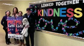  ?? PHOTO PROVIDED BY DARCY SMITH ?? Palmyra-Macedon eighth grader Daisy Jones and her mom, Principal Darcy Smith, are headed to the Super Bowl after Daisy won a video contest promoting kindness. Smith and Daisy are flanked by Susan and Stuart Muszynski (holding Bailey) from the Values-In-Action Foundation.