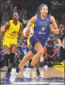  ?? Sam Wasson / Getty Images ?? The Minnesota Lynx’s Napheesa Collier (24) brings the ball up the court against the Los Angeles Sparks on June 8.