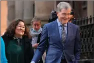  ?? (AP/Rick Rycroft) ?? Steve Johnson (right) and his wife Rosemarie arrive Monday at the Supreme Court in Sydney for a sentencing hearing in the murder of Scott Johnson, Steve’s brother.