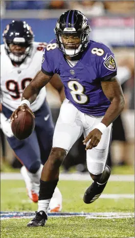  ?? JOE ROBBINS / GETTY IMAGES ?? Former Boynton Beach High star Lamar Jackson scrambles in the third quarter Thursday in the Hall of Fame Game against the Bears in Canton, Ohio.