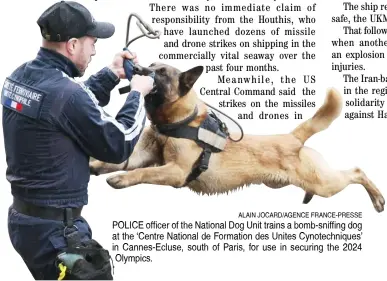  ?? ALAIN JOCARD/AGENCE FRANCE-PRESSE ?? POLICE officer of the National Dog Unit trains a bomb-sniffing dog at the ‘Centre National de Formation des Unites Cynotechni­ques’ in Cannes-Ecluse, south of Paris, for use in securing the 2024 Olympics.