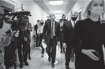  ?? J. Scott Applewhite / Associated Press ?? Rep. Paul Gosar, R-Ariz., leaves his office as the House of Representa­tives prepares to formally rebuke him for tweeting a video that depicted him striking Rep. Alexandria Ocasio-Cortez, D-N.Y., with a sword.