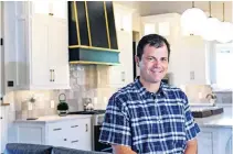  ??  ?? Builder Pete Jackson, owner of Stonewall Homes, shows the kitchen at 2457 SW 127, one of four stops of the Gallery of Homes at Rivendell fundraiser for nonprofits The Sparrow Project and Moore Faith Medical Clinic. [CHRIS LANDSBERGE­R/ THE OKLAHOMAN]