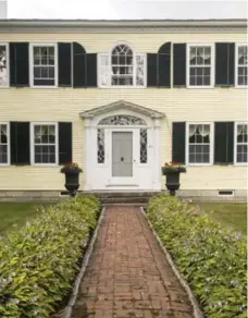  ??  ?? Mary McCarthy’s former house in Castine, in the Down-east region of Maine. She painted the house buttercup yellow to annoy the locals.