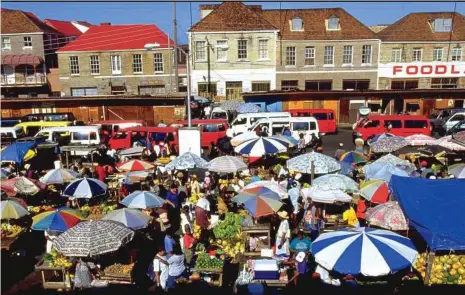  ?? Courtesy of Grenada Tourism ?? Grenada Prime Minister Keith Mitchell says tourism growth in Cuba could also help boost visitors to his island nation. Shown here is St. George’s Market Square in Grenada.