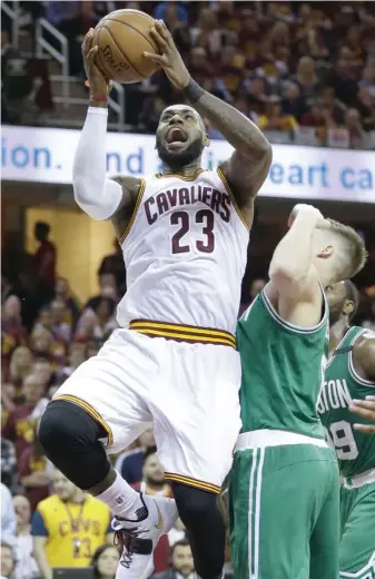  ?? (Photo by Tony Dejak, AP) ?? Cleveland Cavaliers' LeBron James (23) goes up for a shot against Boston Celtics' Jonas Jerebko during the second half of Tuesday's game.