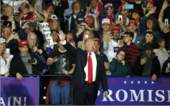  ?? PAUL SANCYA — THE ASSOCIATED PRESS ?? U.S. President Donald Trump waves after a campaign Saturday. rally in Washington Township, Mich.,