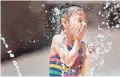  ?? PATRICK BREEN/THE REPUBLIC ?? Shaniya cools down by playing at the splash pad Thursday at Desert Breeze Park in Chandler.