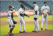  ?? DAVID J. PHILLIP — THE ASSOCIATED PRESS ?? San Francisco Giants manager Gabe Kapler, second from left, takes the ball from starting pitcher Trevor Cahill, second from right, as he pulls him during the second inning Wednesday against the Houston Astros in Houston. Catcher Tyler Heineman is left and third baseman Evan Longoria is right.