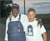  ??  ?? Lawrence Scott, right, with Willie Seabury, known as Po Monkey and the owner of the famous Po Monkey's Juke Joint in Mississipp­i.