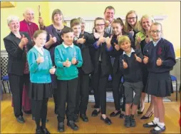  ??  ?? The Bishop of Dover, Rt Rev Trevor Willmott, celebrates the launch of the trust with head teachers and pupils