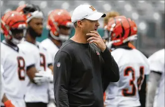  ?? PHOTOS BY JOHN MINCHILLO / AP ?? Cincinnati head coach Zac Taylor said his goal was for his new team to use its spring practices and workouts to get better, and he believes the Bengals accomplish­ed that.