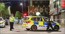  ??  ?? BloodBath: Police at the scene of a shooting near West Croydon station