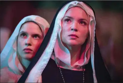  ?? ?? A young novice nun in 17th-century Italy, Sister Bartolomea Crivelli (Daphne Patakia), embarks on an affair with senior nun Sister Benedetta Carlini (Belgian actress Virginie Efira) in Paul Verhoeven’s “Benedetta,” based on a true story.