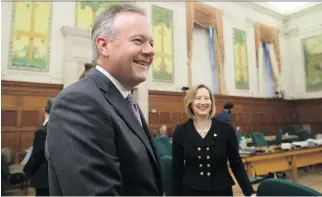  ?? ADRIAN WYLD/THE CANADIAN PRESS ?? Bank of Canada governor Stephen Poloz and senior deputy bank governor Carolyn Wilkins wait Tuesday to appear before the House of Commons finance committee.