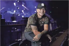  ??  ?? Country singer Kane Brown’s 2016 self-titled debut album and its deluxe release last year spawned two multi-platinum hits, “Heaven” and “What Ifs,” but the breakout star was snubbed at the Country Music Associatio­n Awards this year. MARK HUMPHREY/AP