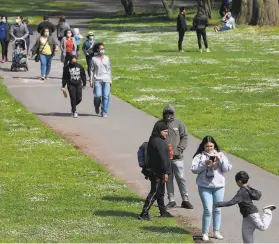  ?? Yalonda M. James / The Chronicle ?? With the yearlong COVID pandemic restrictio­ns coming to an end, San Franciscan­s are ready to return to beloved destinatio­ns like Golden Gate Park.