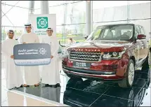  ??  ?? Delivering Range Rover award to a winner.