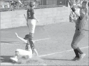  ?? MARK HUMPHREY ENTERPRISE-LEADER ?? Farmington sophomore Paige Anderson slides home to score a run on a passed ball while Mena pitcher Autumn Powell tries to cover home plate. The Lady Cardinals prevailed 12-0 and placed second in the Farmington Invitation­al softball tournament they...