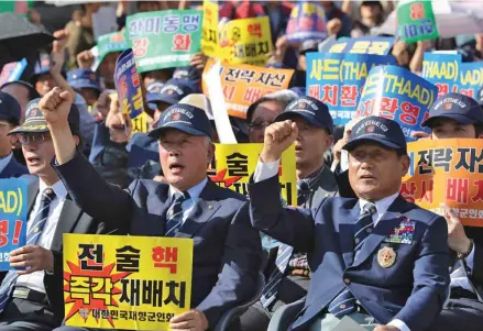  ??  ?? South Korean war veterans rally in Seoul against North Korea’s nuclear programme.