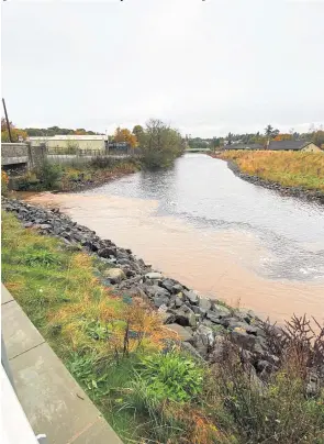  ?? ?? Disgusting The “filthy brown sludge” seen seeping into the River Almond