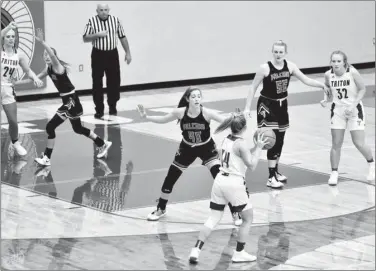  ?? PILOT PHOTO/RON HARAMIA ?? Glenn players Emma Romer (far left), Jessica Yelaska (middle) and Mia Hooten (55) play defense while Triton’s Kinsey Atkins (with ball), Abbey Viers (24) and Lexia Hostrawser look for room to roam during a high school girls game earlier this season. The Lady Falcons are scheduled to host South Central Saturday, while the Lady Trojans continue to quarantine due to COVID issues and have not played since Nov. 4.