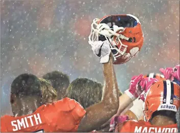  ?? File, John Bazemore / The Associated Press ?? Clemson players huddle on the field before the Tigers’ game against Georgia Tech in Clemson, S.C.