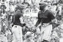  ?? DAVID BANKS USA TODAY Sports ?? The Marlins’ Luis Arraez greets right fielder Jorge Soler at home plate after Soler hit his seventh home run of the season, a solo shot in the third inning Saturday against the Cubs. Soler had two hits and a walk and scored two runs on the day.