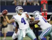  ?? MICHAEL AINSWORTH — THE ASSOCIATED PRESS ?? Dallas Cowboys’ quarterbac­k Dak Prescott (4) throws a pass during the first half of a preseason game against the Oakland Raiders this past weekend. Prescott and the Cowboys will look to be the first repeat winners of the NFC East since the Eagles won...
